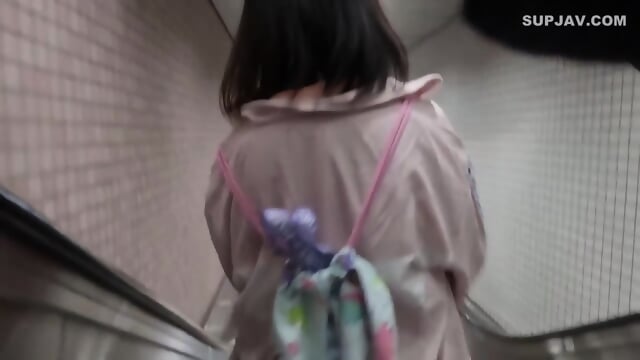 Stalking 07 A young girl with brown skin and mouths wide open walks around studying outside of school