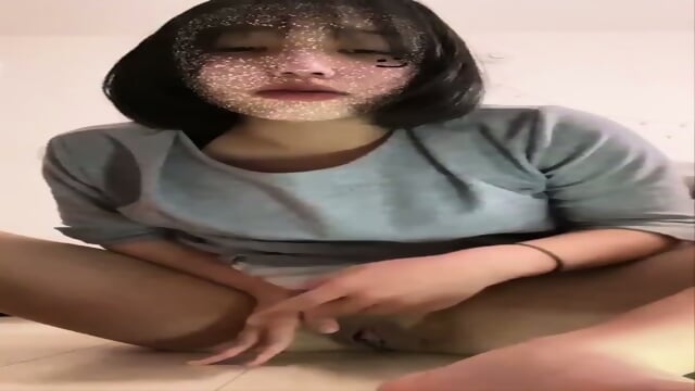 The Japanese woman named ahoo cums by inserting her fingers