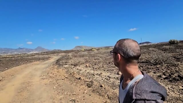 Actual Physical Intimacy Set Amidst The Arid Expanse Of The Yellow Mountains Desert Landscape