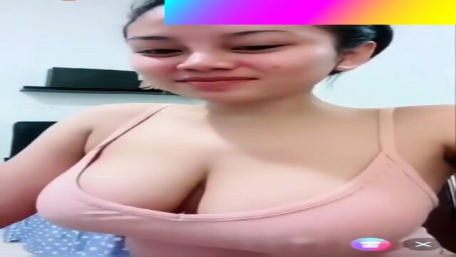 Asian babe showing off her big amazing tits LIVE