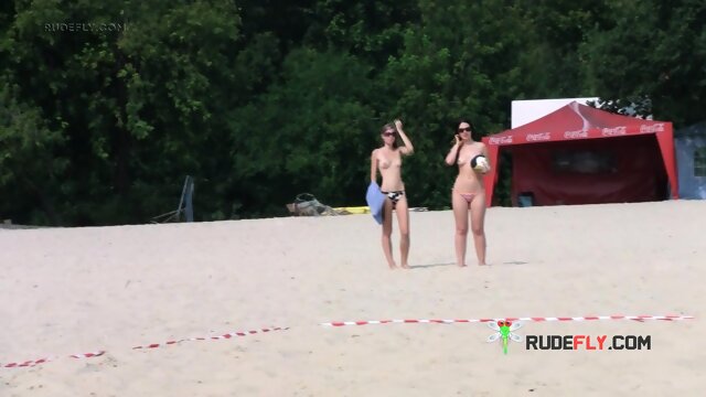 Dashing young nudist chicks have fun at the beach